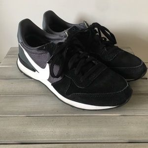 Black suede Nike sneakers